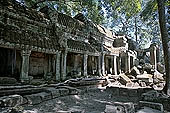 Ta Prohm temple - the badly ruined gopura of the gallery first found entering the site from west